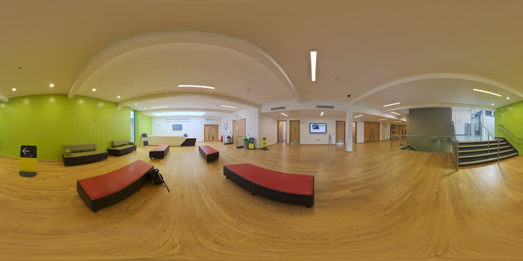 360° capture of Reception & Lobby on 23 July 2026 — Finishes complete and lit. Counter, seating and stair balustrade in.